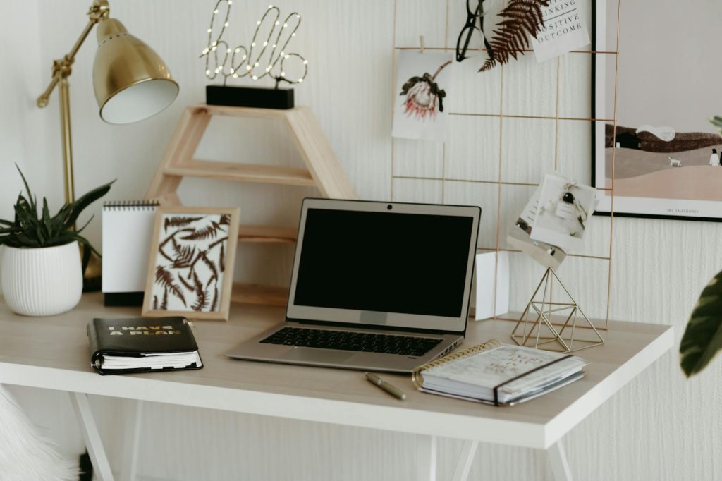Stylish home office workspace featuring a laptop, desk decor, and practical office supplies.