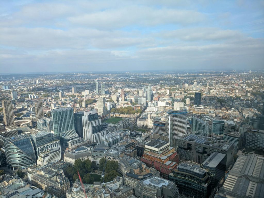 A breathtaking aerial view of London's skyline showcasing modern architecture and sprawling cityscape.