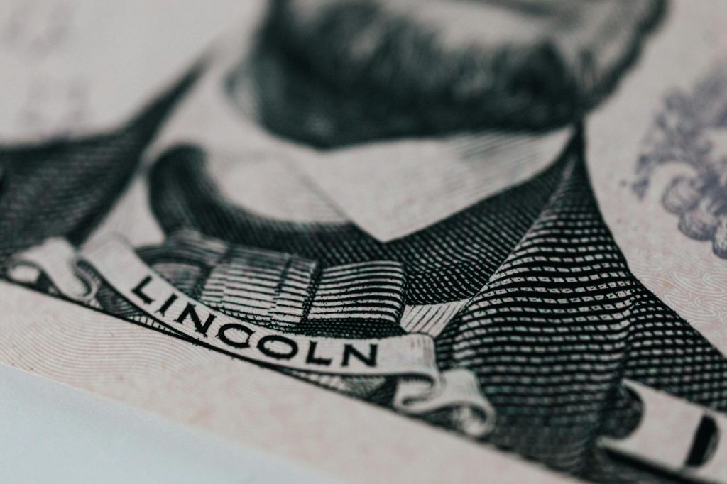 Detailed close-up of Abraham Lincoln's portrait on currency showcasing intricate engraving.