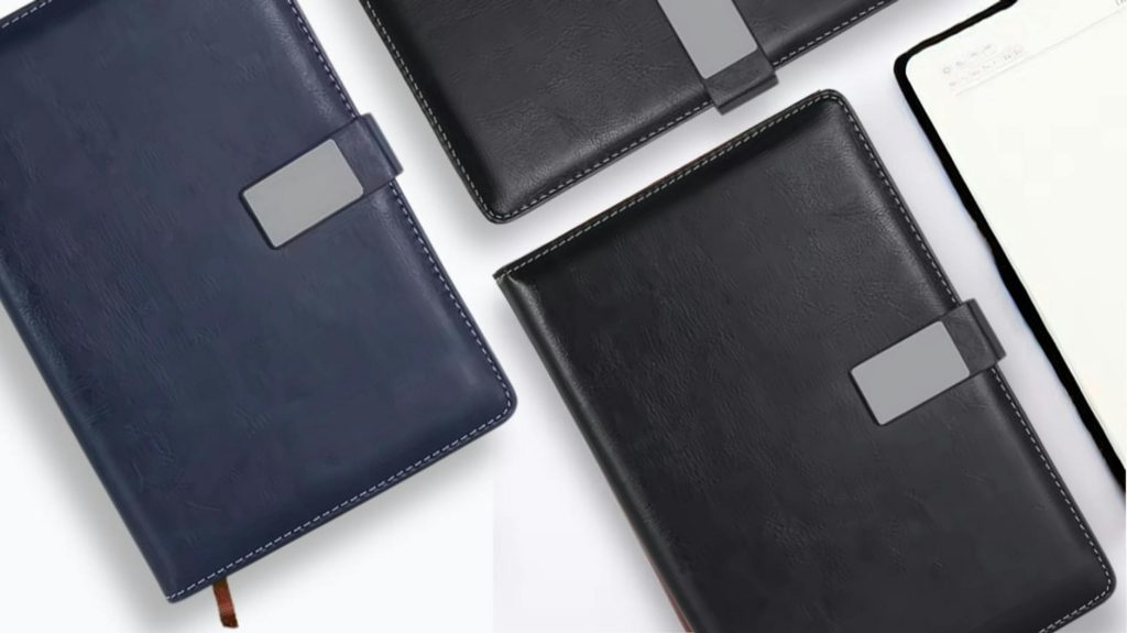 Top view of luxury leather notebooks featuring a sleek magnetic closure, perfect for professionals.