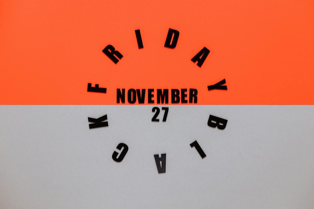 Stylish Black Friday letters arranged creatively on a vibrant background.