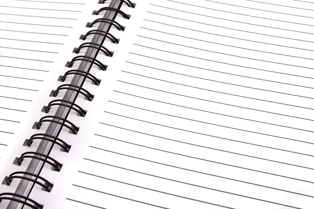 Open spiral notebook with lined pages, perfect for notes and planning.