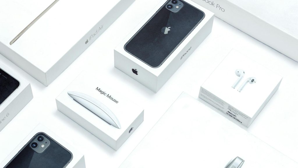 Flat lay of assorted Apple product boxes showcasing technology packaging design.