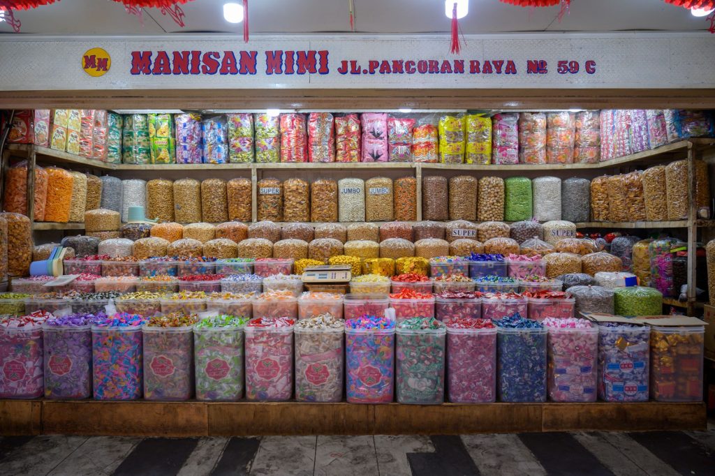 A vibrant display of assorted candies at Manisan Mimi, Jakarta, Indonesia, showcasing colorful local treats.
